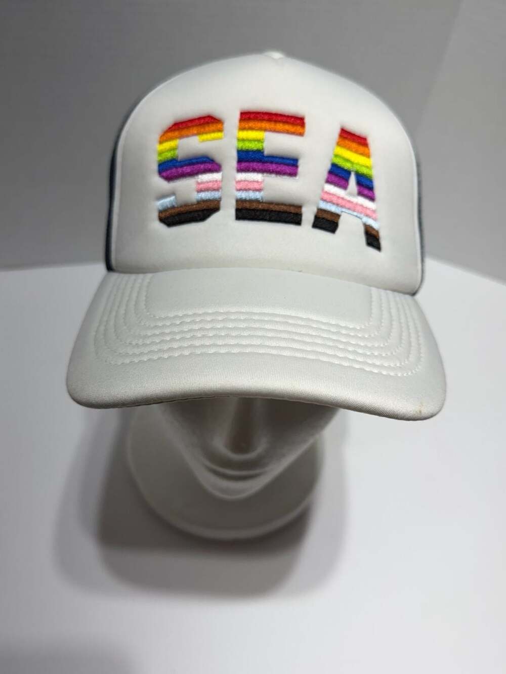Melonwear SEA Pride Trucker Hat White Navy Blue Rainbow
